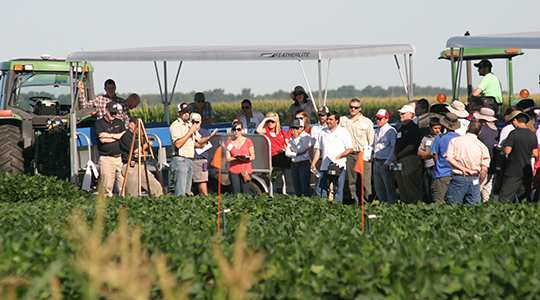 Image of a group of people happily looking out to the distance.