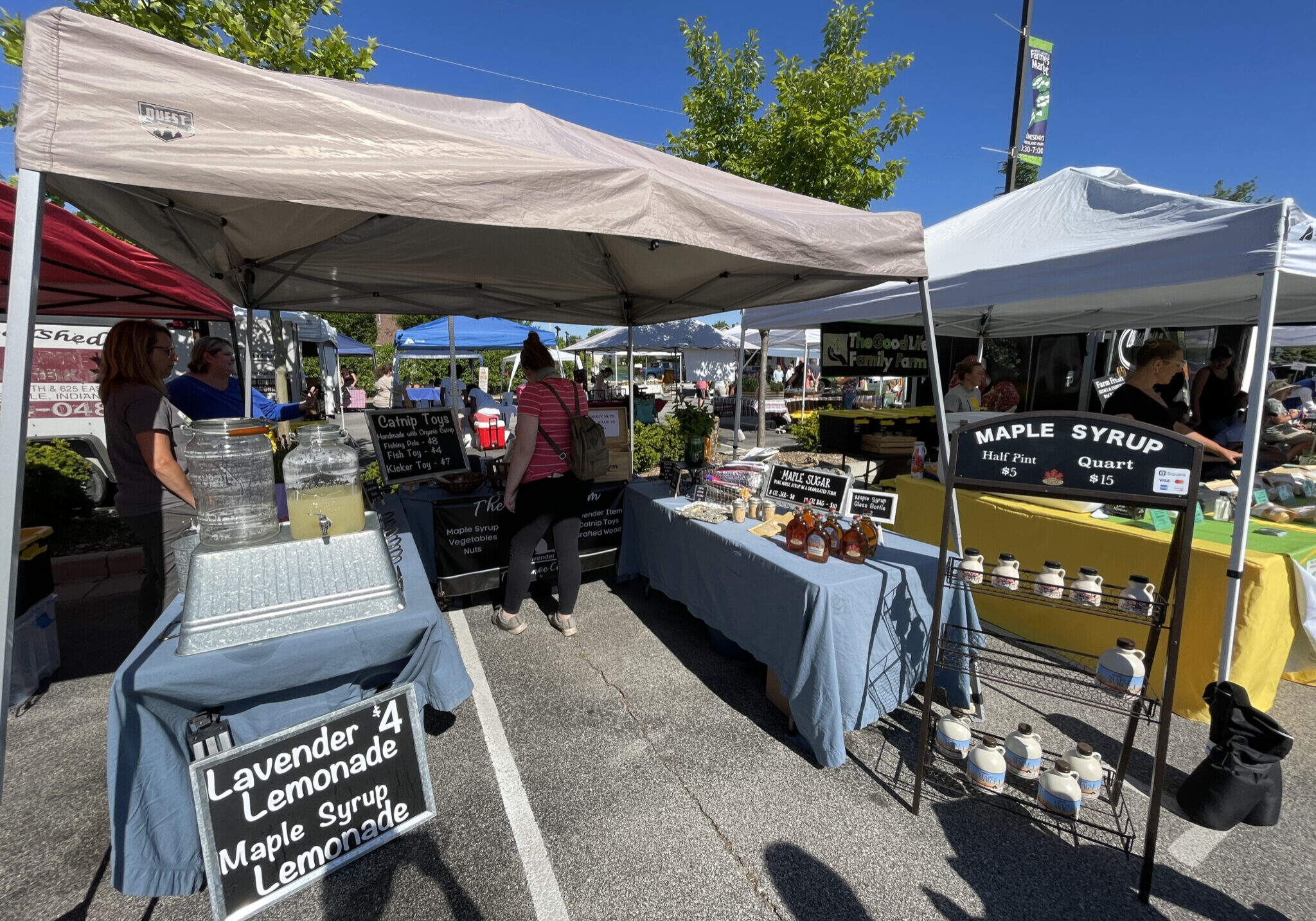 Picture of booths at a farmers market.