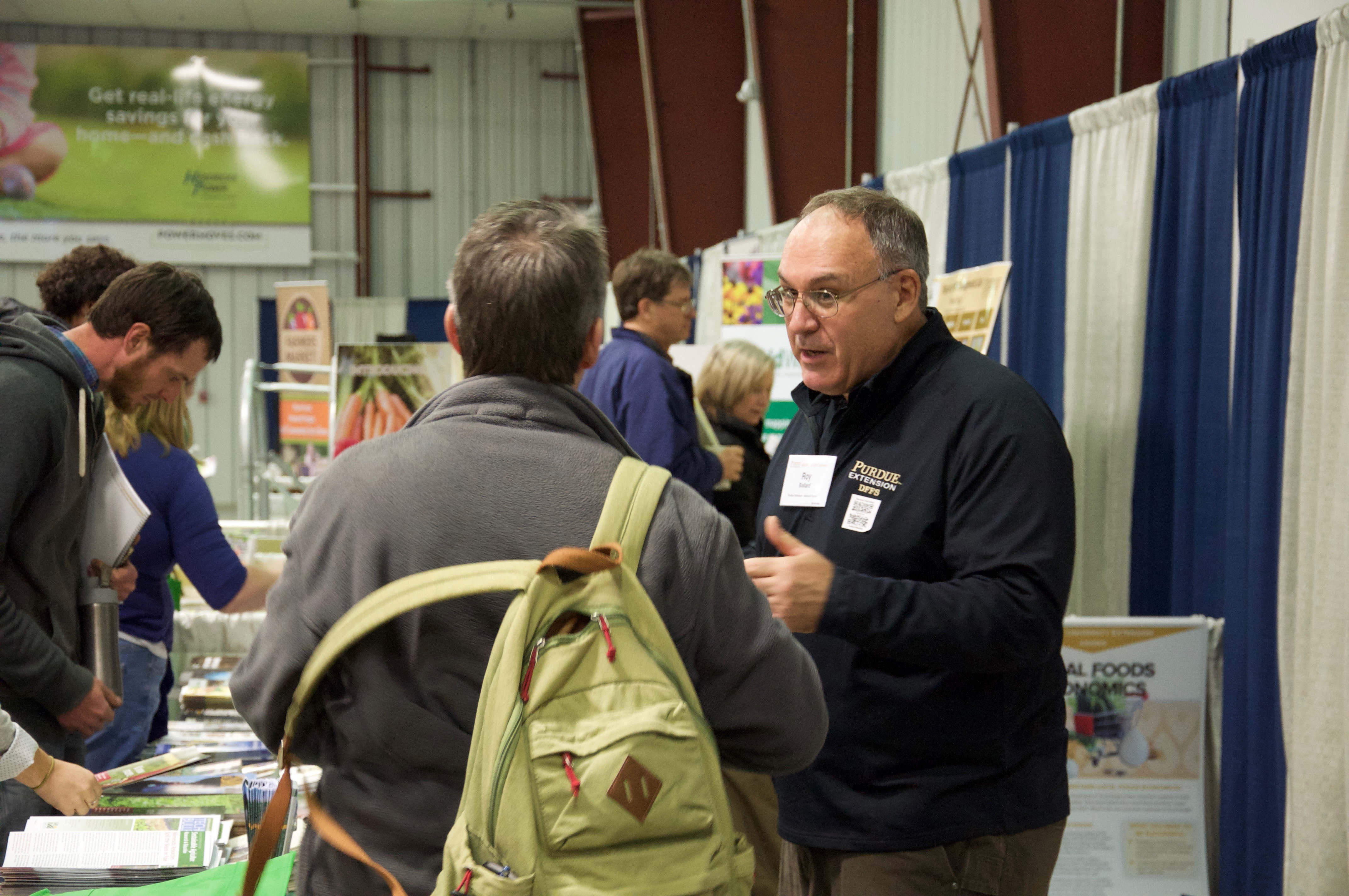 Image of Purdue employee at a booth