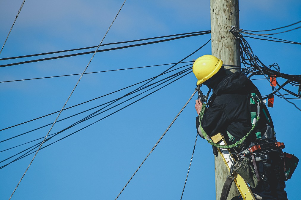 man working on telephone pole