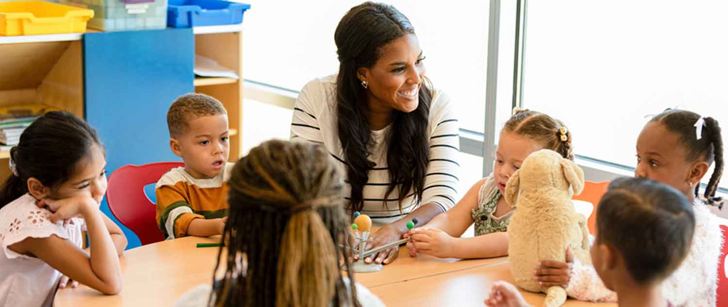 Young female instructor with children