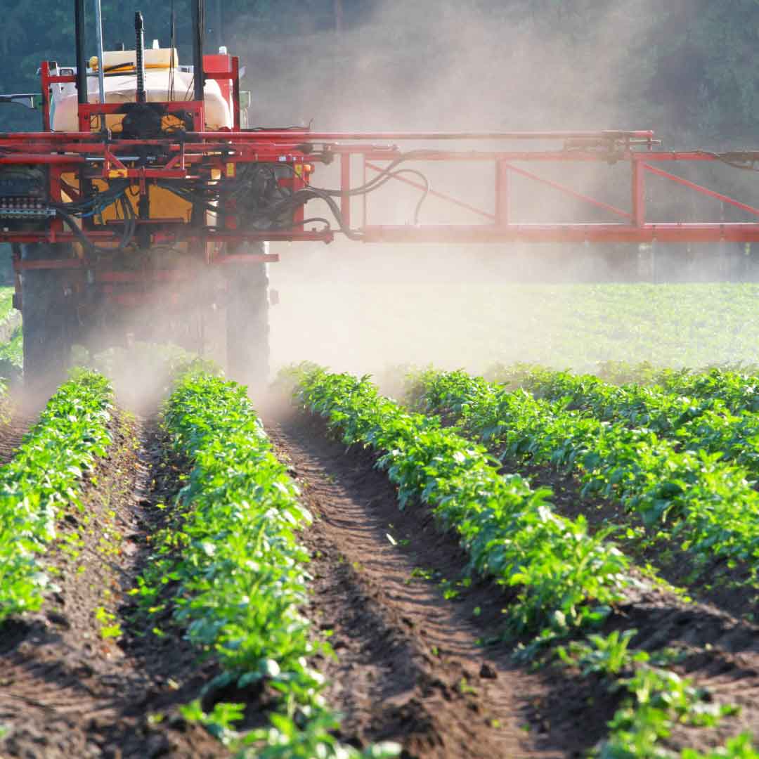 tractor spraying field