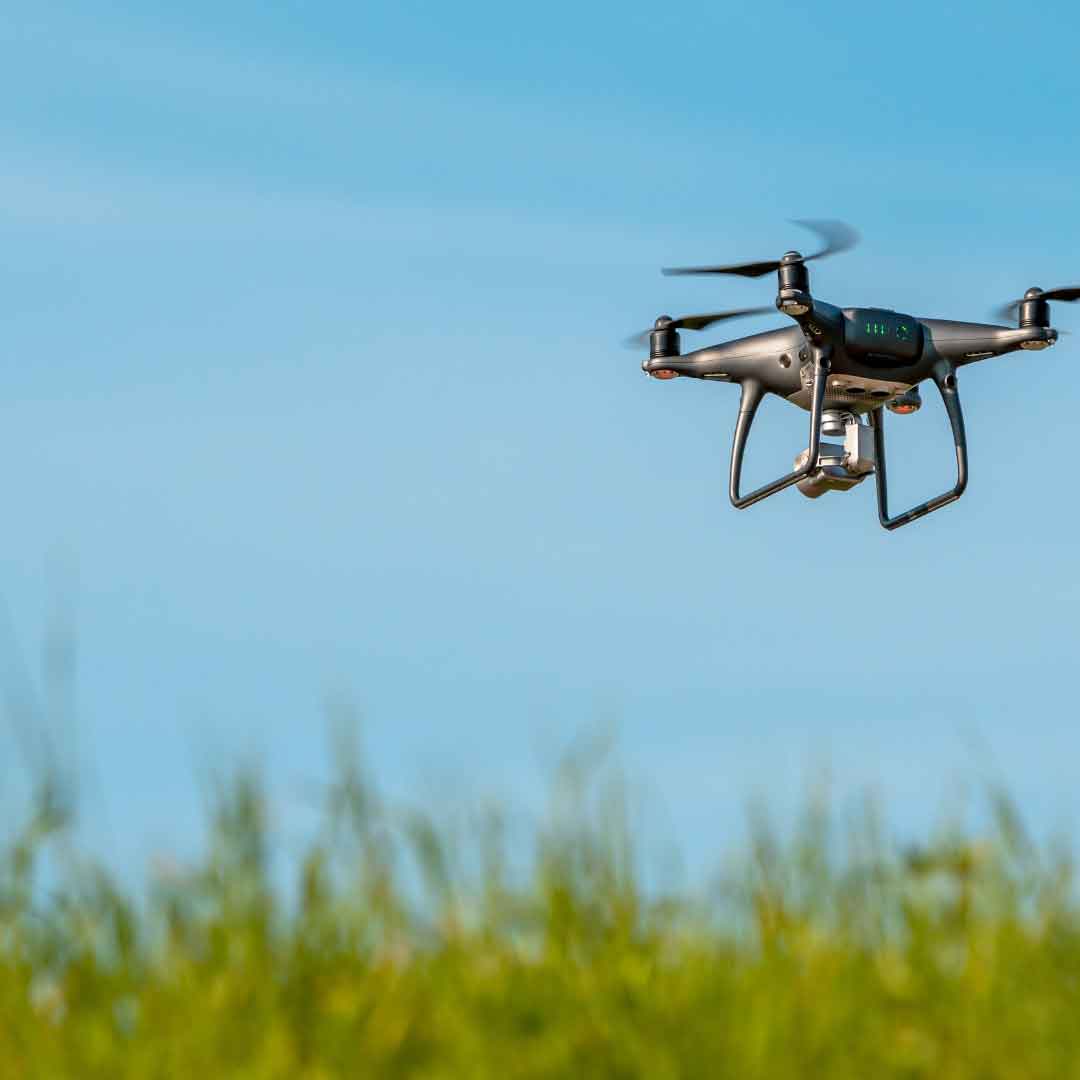 drone flying over field