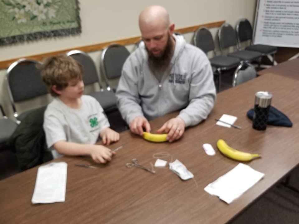 Club members practicing sutures. 