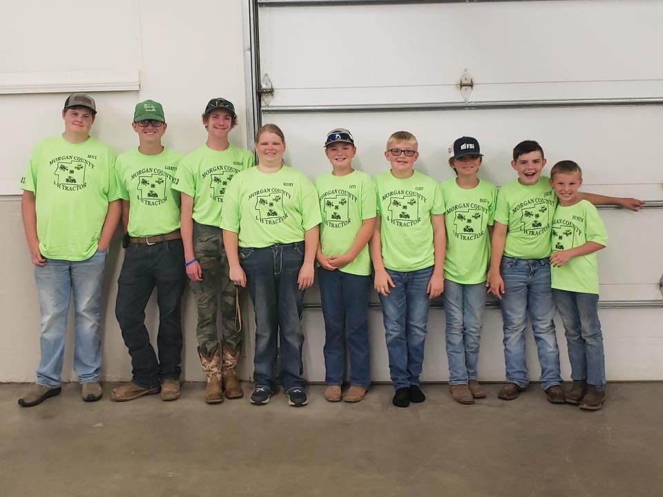 Tractor Club Members in their green t-shirts all in a line.