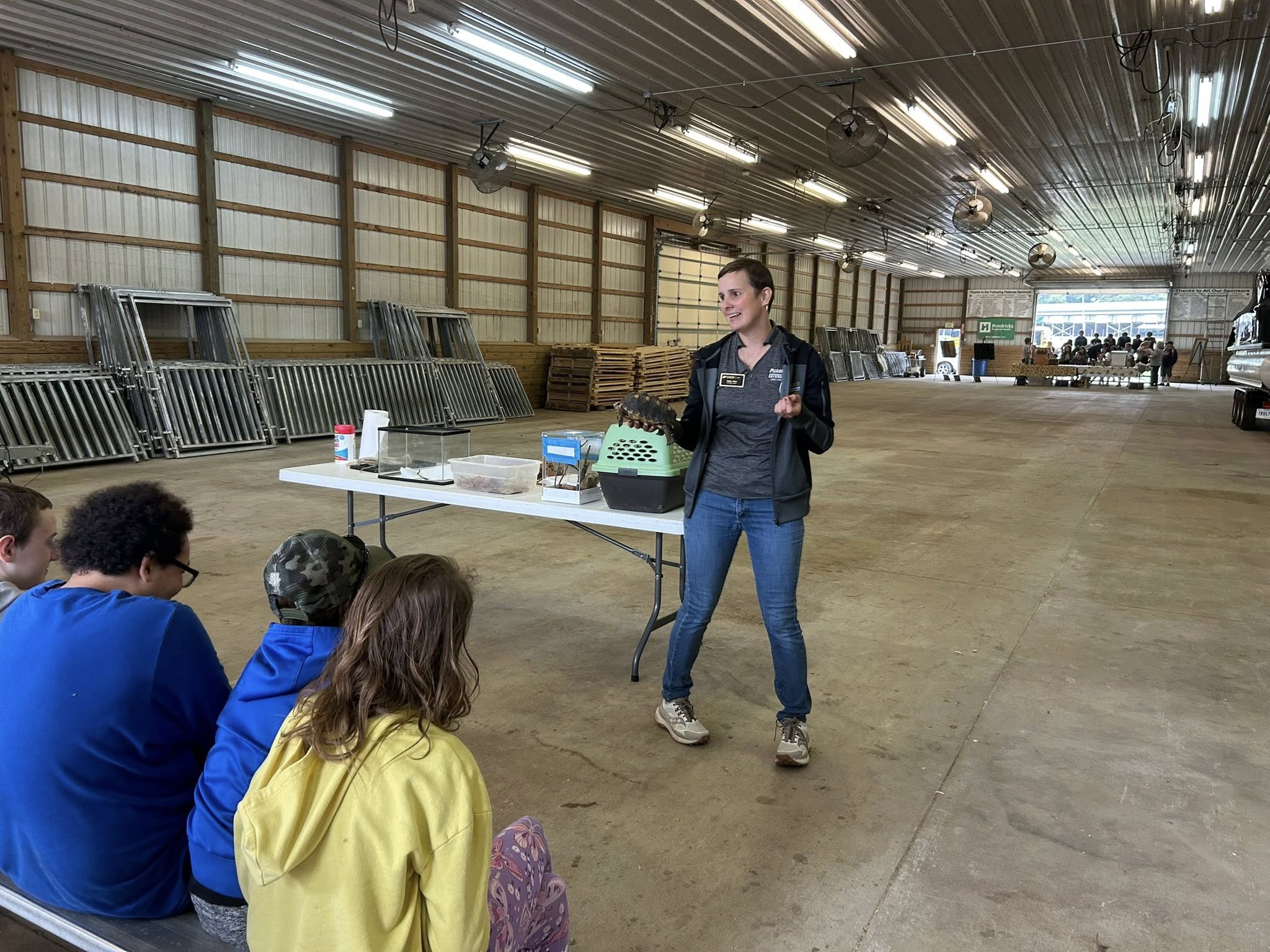 Speaker holding a turtle