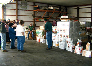 EPA personnel reviewing the storage area of an agricultural facility.