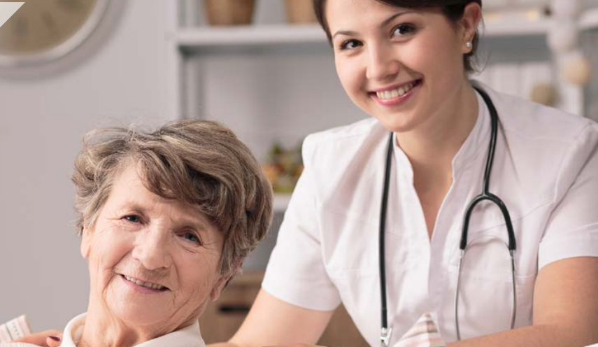 health provider pushing a person on a wheelchair 