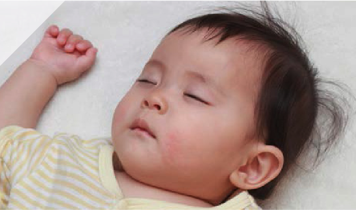 a baby sleeping on his back
