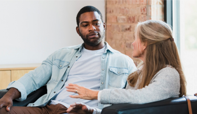 a couple looking at each other talking