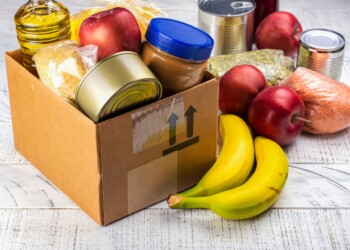 box with can food and fruits