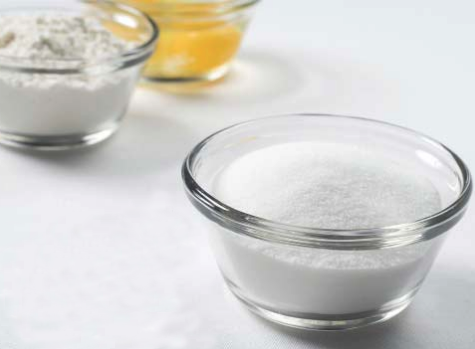 Three bowls with spices (flour, eggs, suggar)