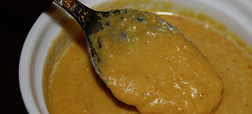 image of a salad yellow creamy dressing 