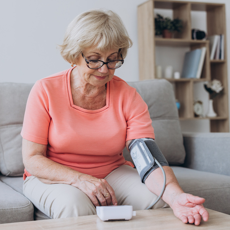 woman measuring her blood pressure 