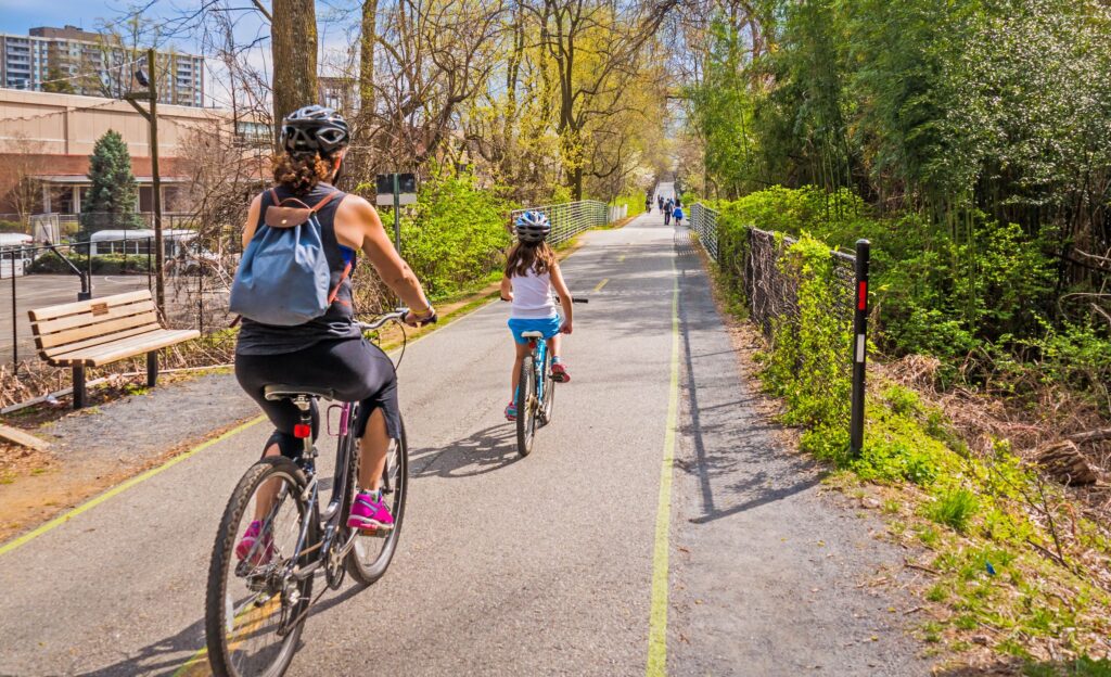 mother and daughter biking outdoors