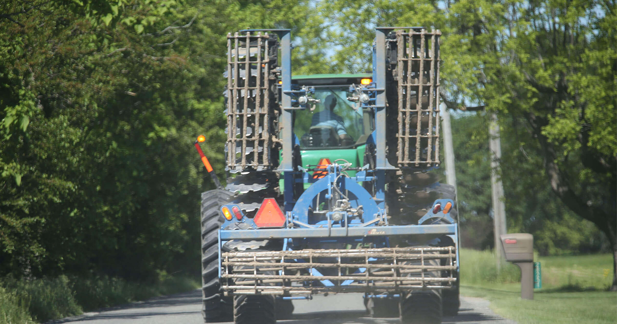 Farm vehicle traveling road