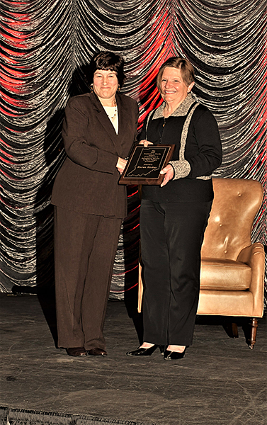 Karen Plaut, the Glenn W. Sample Dean of Purdue College of Agriculture, left, presents Extension educator Karen Richey with the 2021 Frederick L. Hovde Award of Excellence in Educational Service. (Purdue University photo)