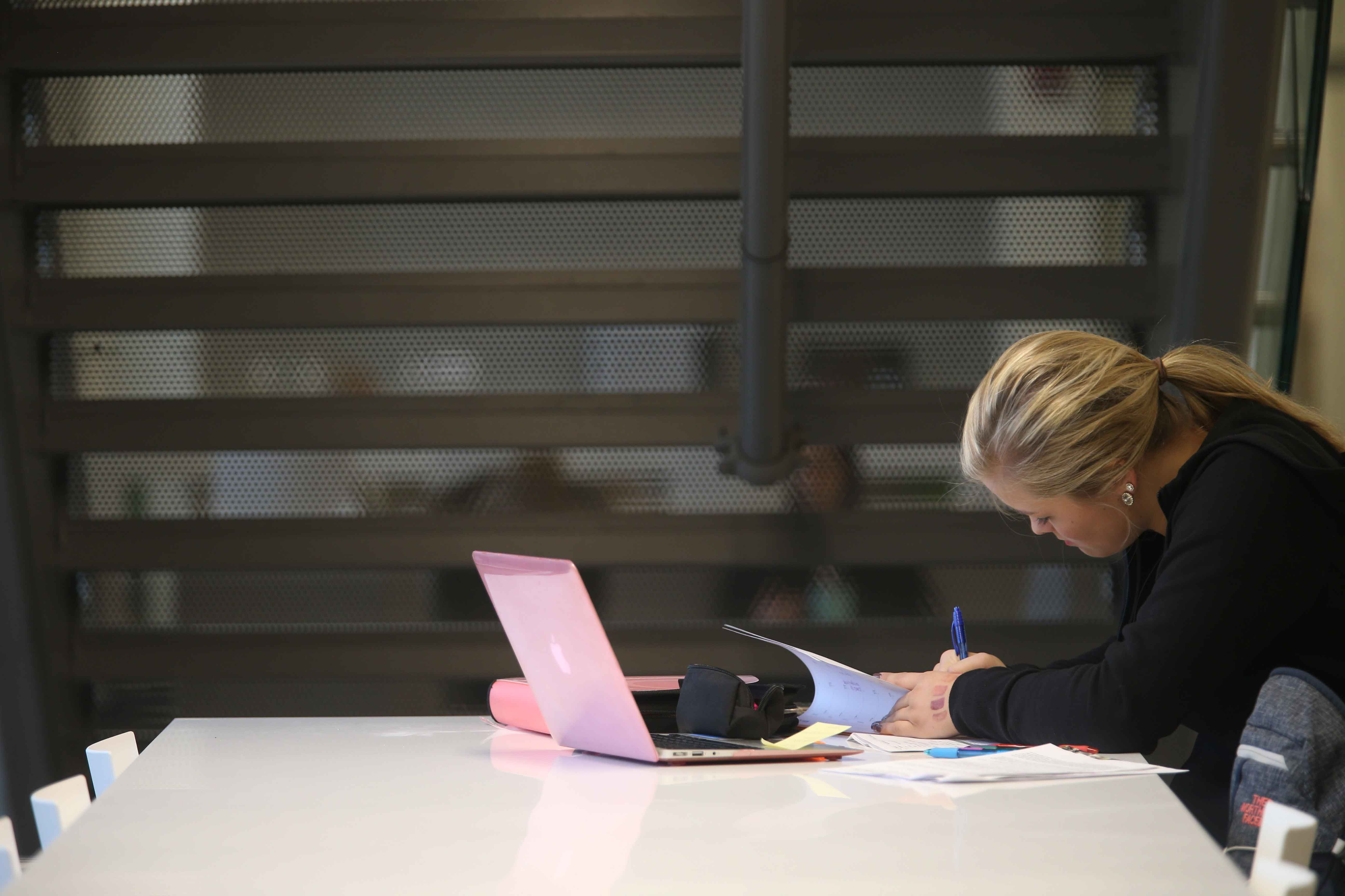 woman working at desk late at night