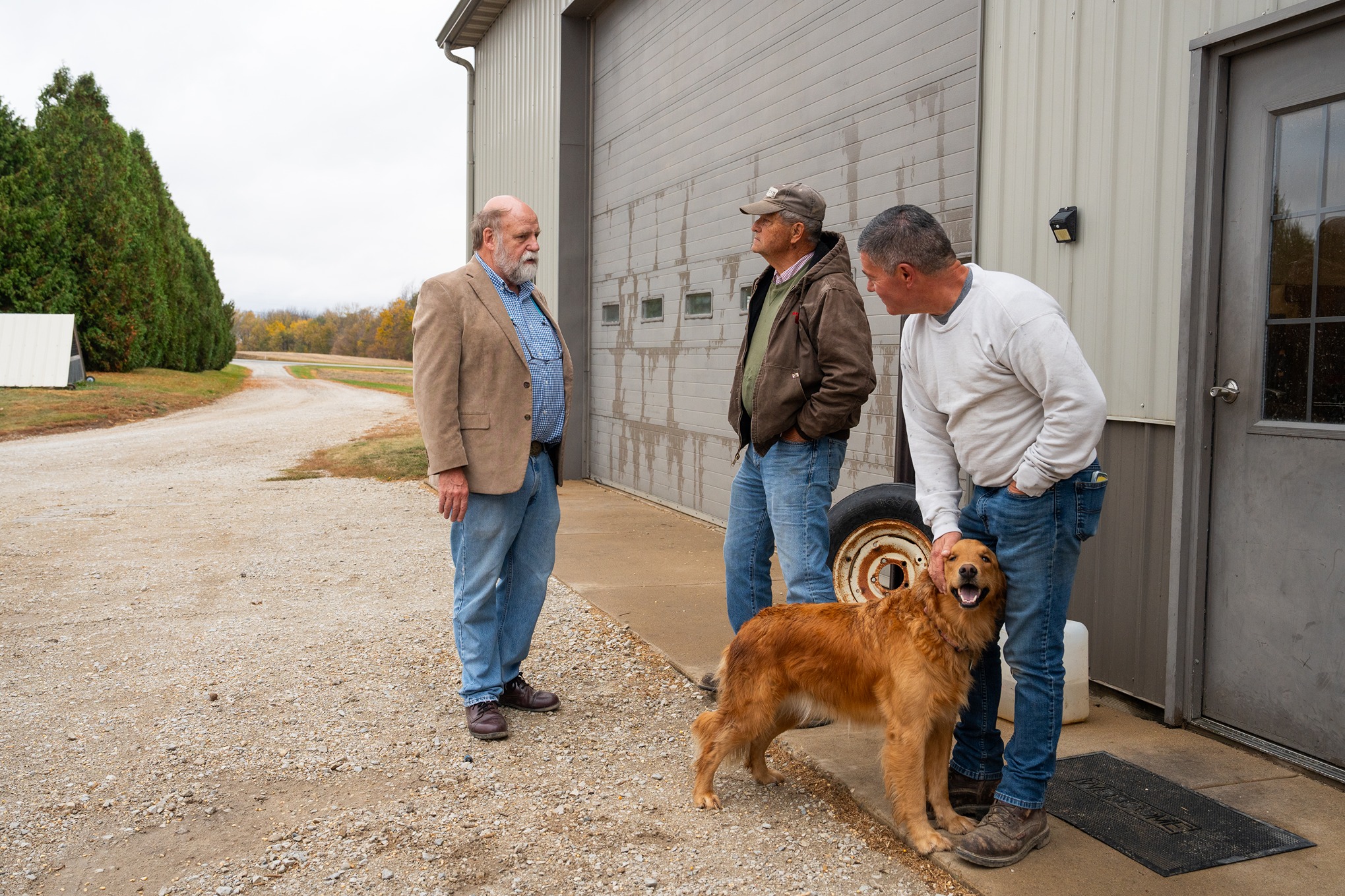 Fred Whitford talks to Larry and Kevin Underwood at Underwood’s farm in Tippecanoe County.