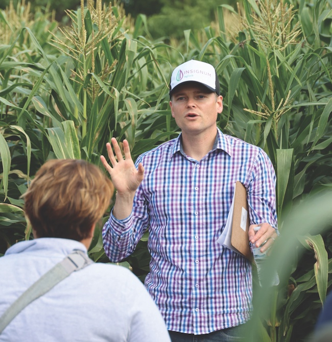 Kyle Mohler talking to a person outdoors