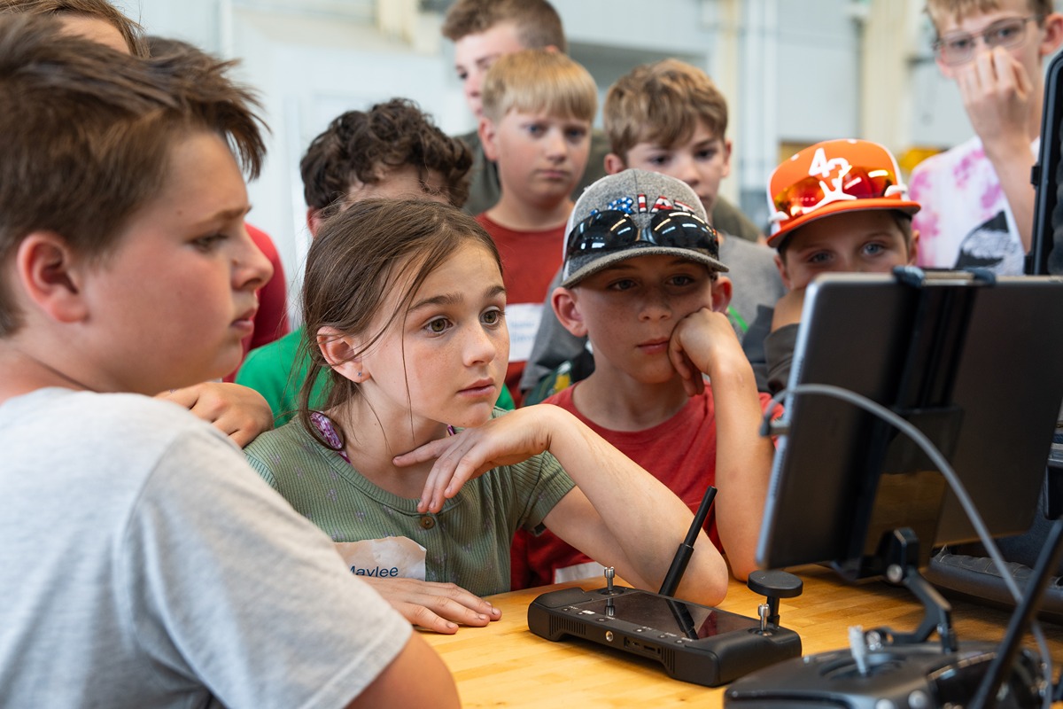 Youth at Experience 4-H: Crop and Soil Science, a one-day event, learn how a drone controller works. (Joshua Clark)