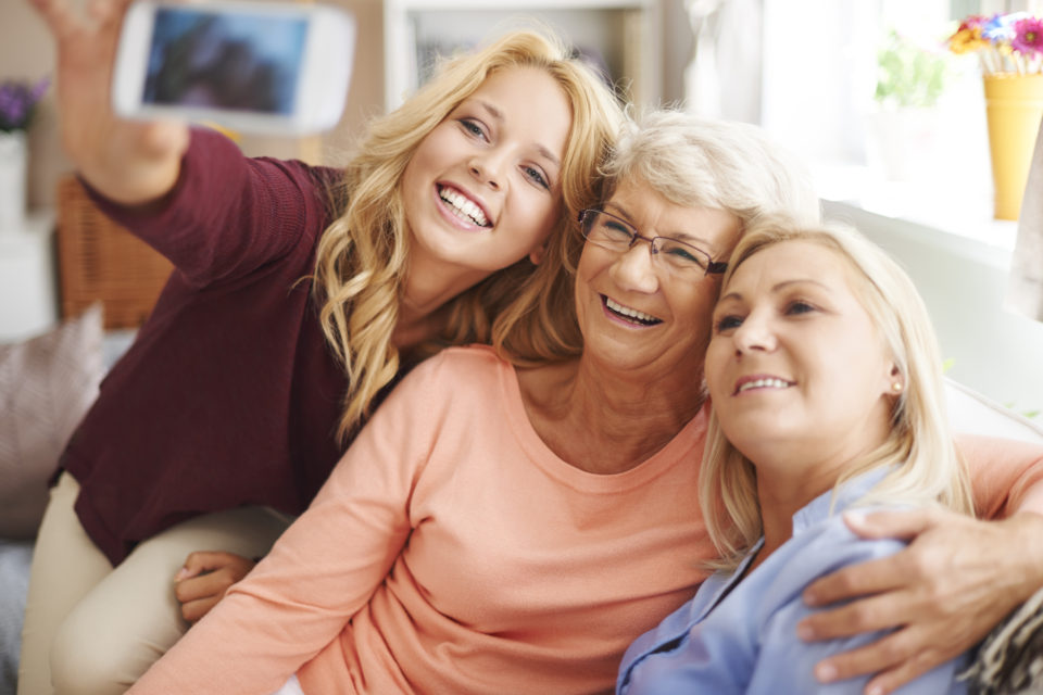 storyblocks-blonde-girl-taking-selfie-with-mom-and-grandma_hbezq4awqz-960x640.jpg