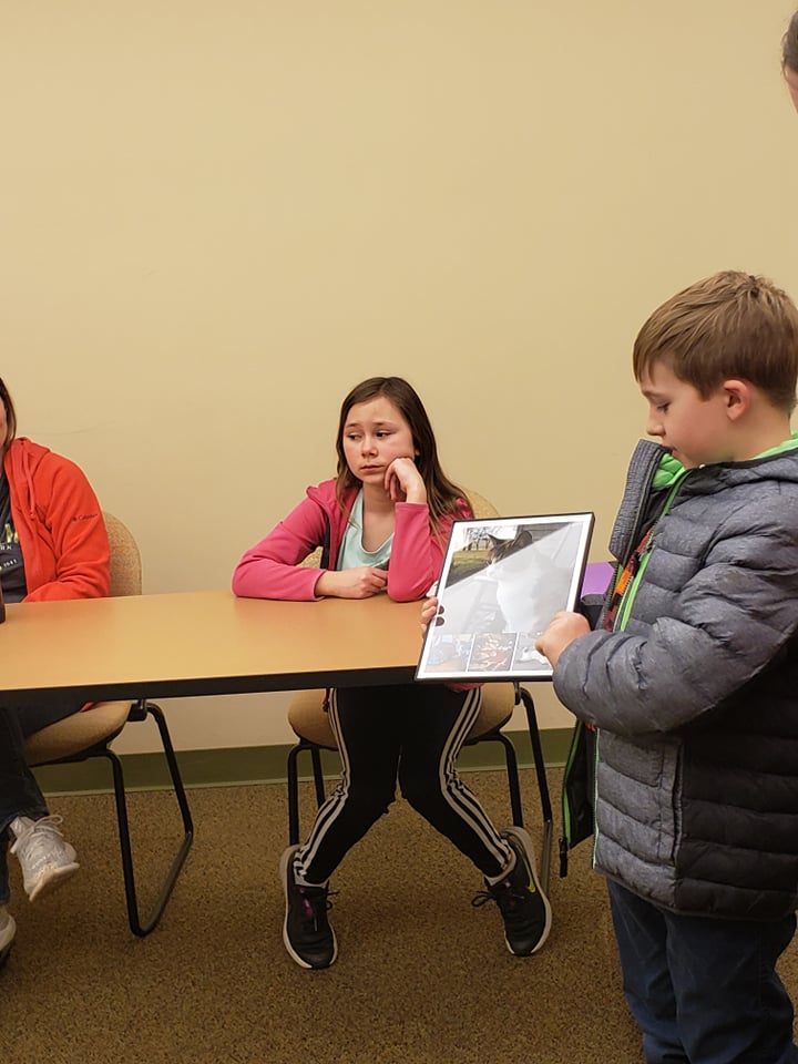 child showing cat art