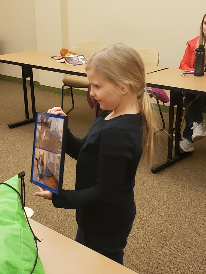 child showing cat art