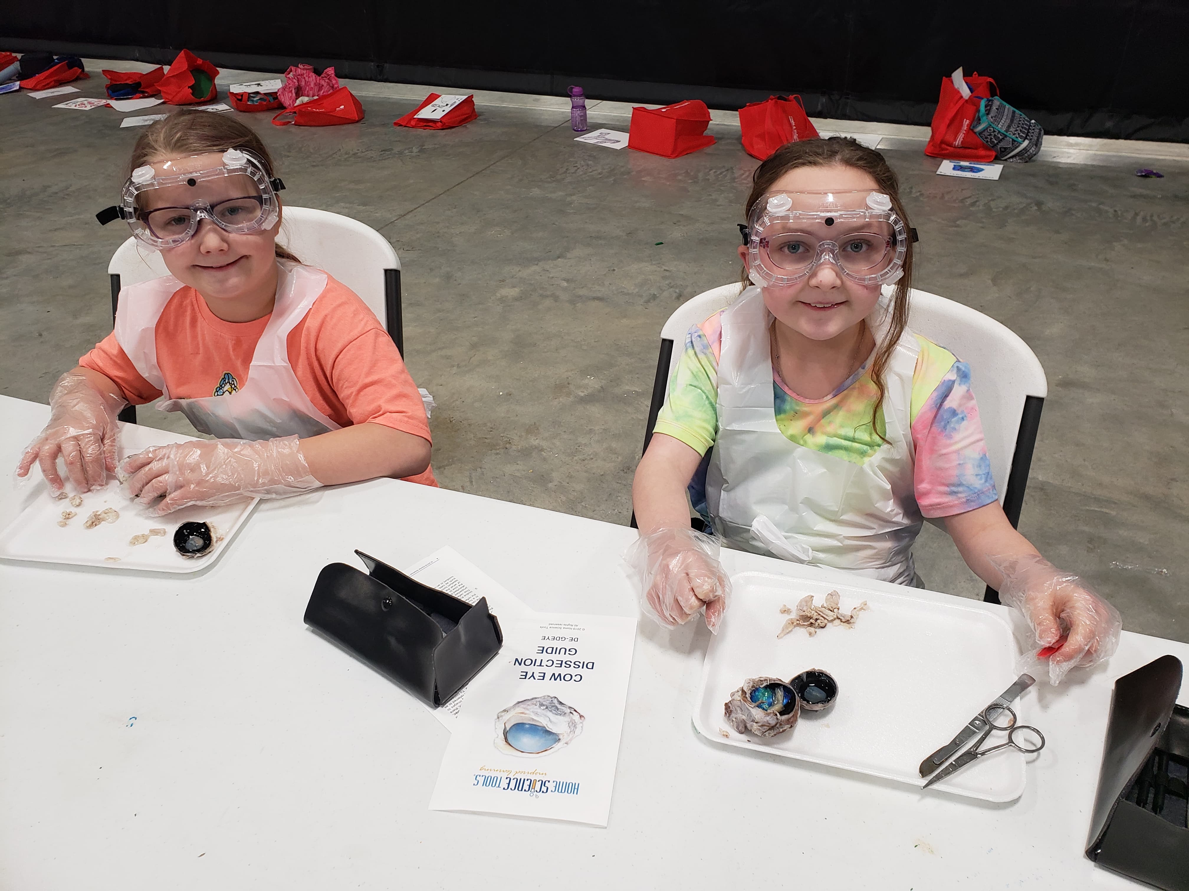 children with tools at tables