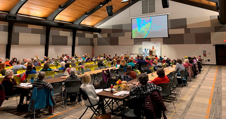 Large audience watches a presentation at the 2023 Spring Garden Clinic