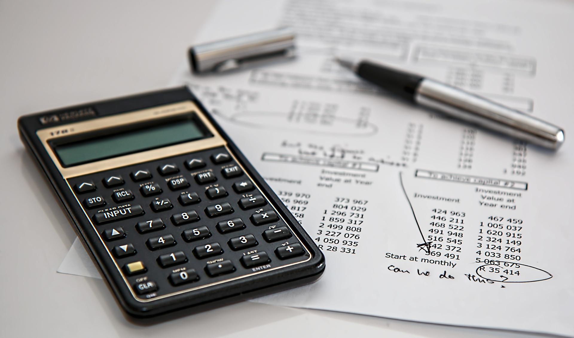calculator with a pen and paper