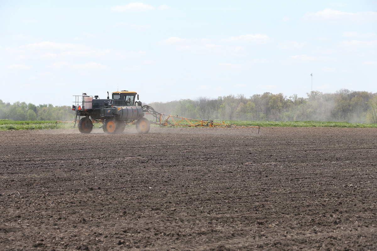 Agricultural spray rig making an application on a farm field