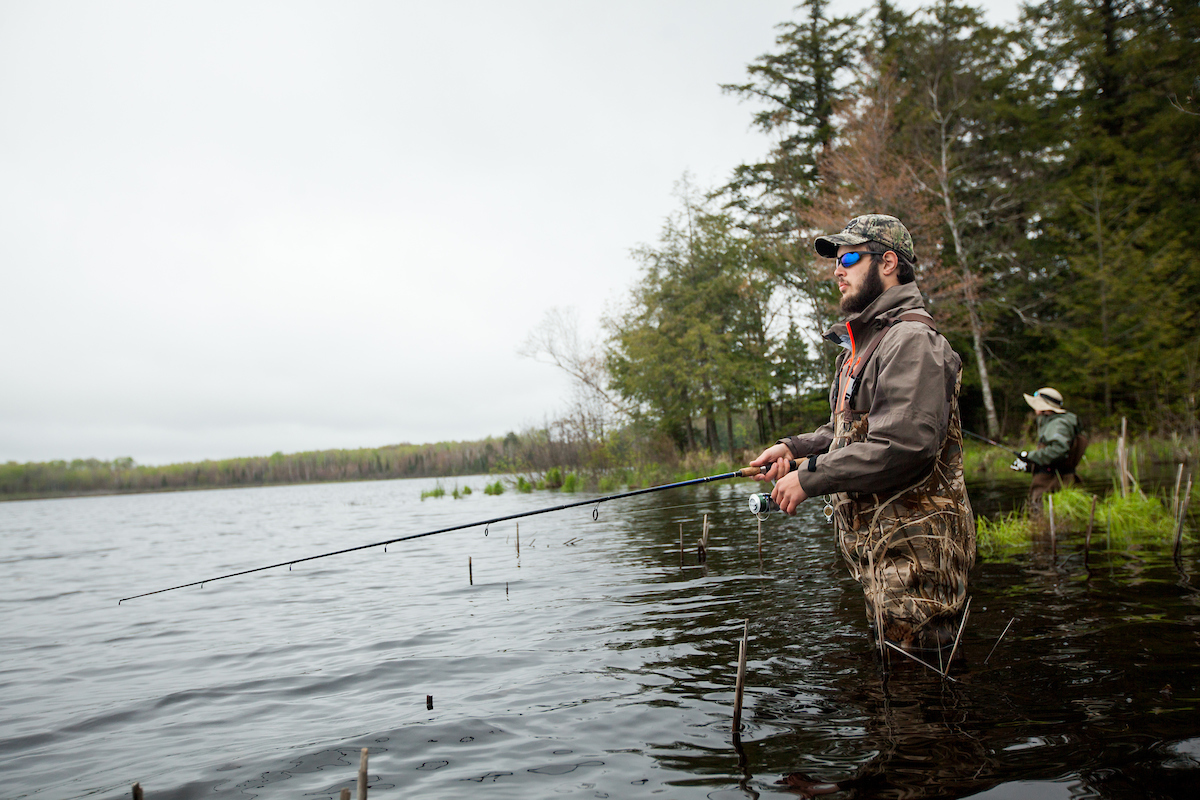 person fishing in a pond
