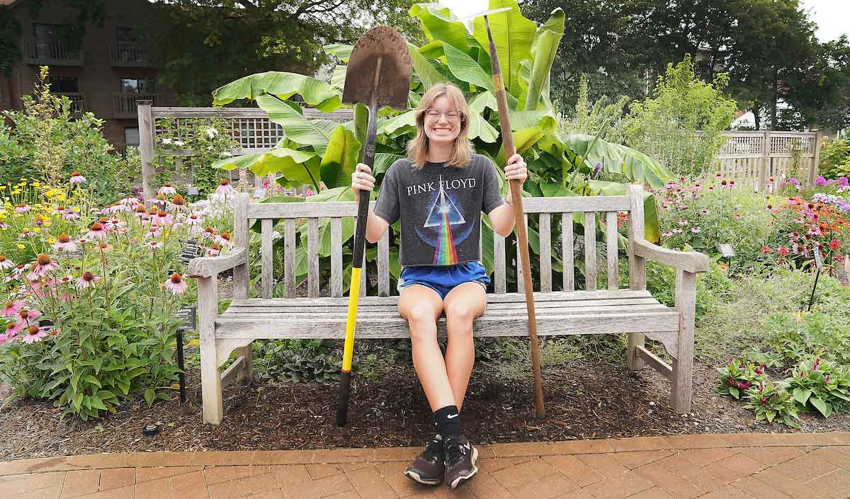 Gardener holding garden tools