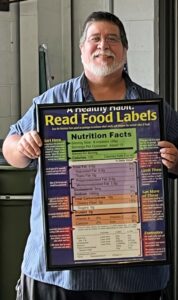 student holding a poster