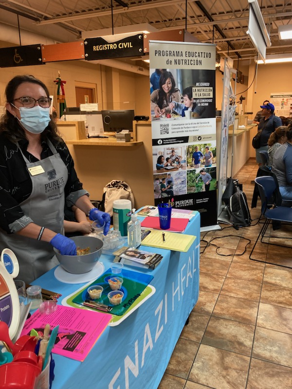 Diana at the conference booth
