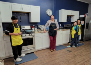 Teens in a kitchen classroom