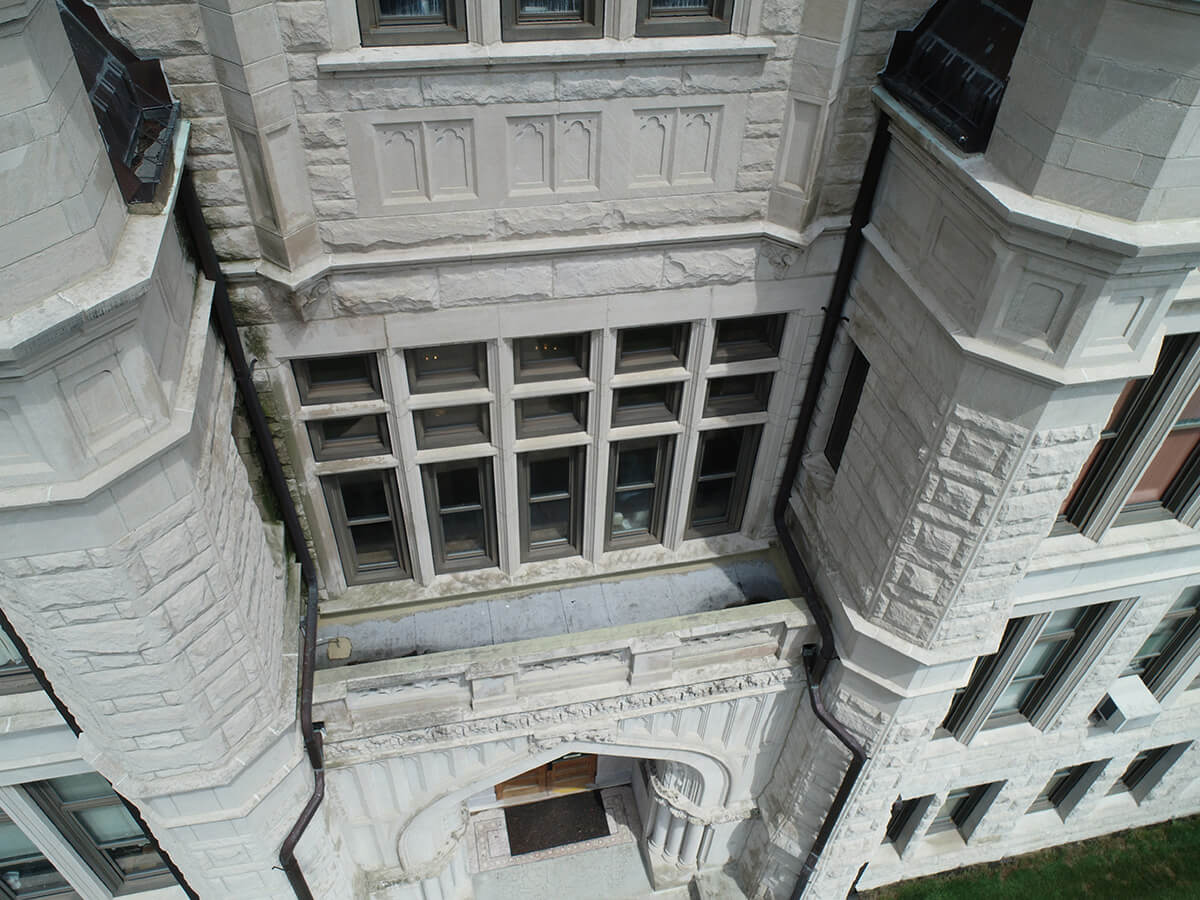 Image of a building windows showing signs of leaking