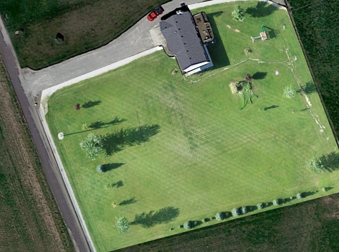 Image of a house with lawn after mowing